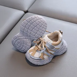 Silver and beige toddler walking shoes featuring mesh upper and anti-slip soft soles