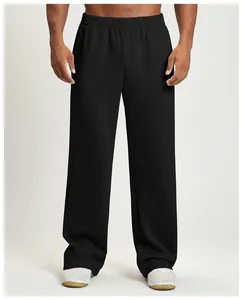 Close-up detail of black wide-leg joggers for men with a relaxed fit for sports