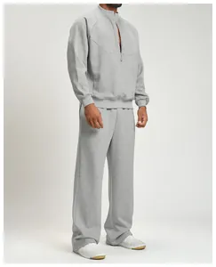 Full view of men's athletic grey loose wide-leg jogger sweatpants worn by a model