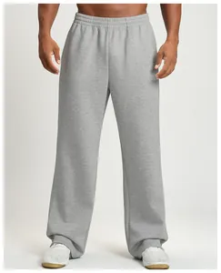 Detail of men's loose grey wide-leg joggers for athletic training and casual wear