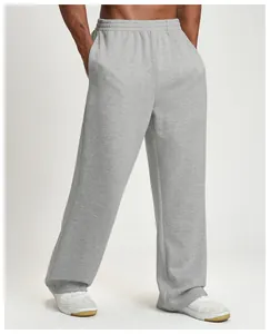 Detail view of men's loose wide-leg grey athletic sweatpants with elastic waistband