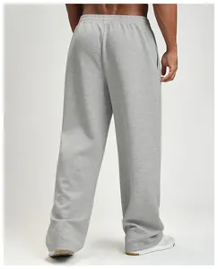 Detailed back view of men's loose grey wide-leg sweatpants featuring elastic waistband