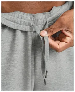 Detailed close-up view of men's grey sports jogger waistband featuring an adjustable drawstring