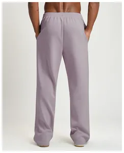 Back view of men's lavender wide-leg joggers showing loose fit and elastic waist