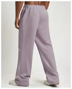 Rear detailed view of purple wide-leg joggers for men in a loose and sport style