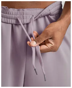Detailed macro view showing the drawstring waistband of men's lavender leisure joggers