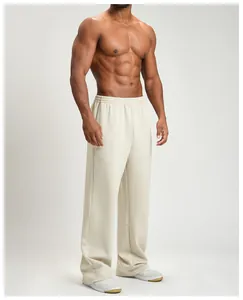 Men's fashionable loose wide-leg sports joggers in beige for fitness training and casual wear.