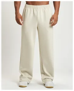 Close-up view of men's fashionable beige wide-leg joggers for gym and casual wear