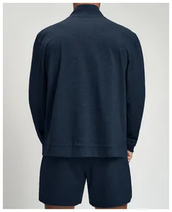 Rear view of a men's navy knit athletic jacket showing breathable fabric texture.