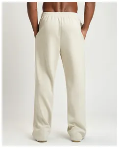Rear view of men's cream-colored wide-leg joggers with elastic waistband detail
