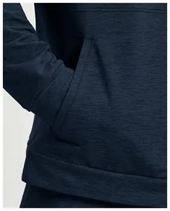 Detail view of the pocket and cuff on a dark blue knitted sports jacket for men