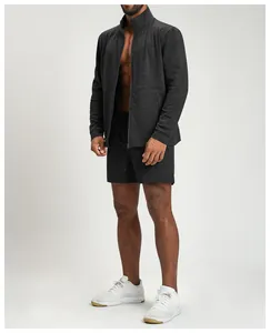 Full-length view of men's dark grey athletic zip-up jacket and shorts set