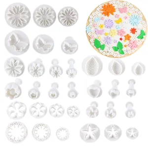 Professional 33-piece fondant cake cutter set with various floral and butterfly shapes
