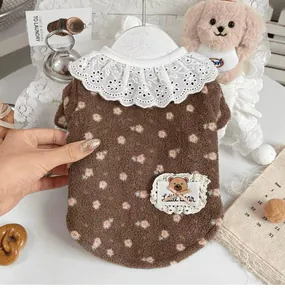 Detail view of brown floral pet fleece sweater with white lace collar