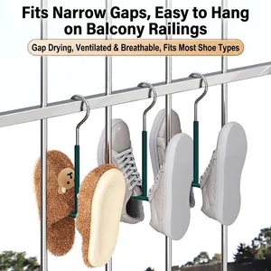 Detail of multi-functional stainless steel shoe drying hooks on a balcony railing.