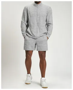 Detailed view of grey knit men's sports jacket and matching shorts set for outdoor fitness