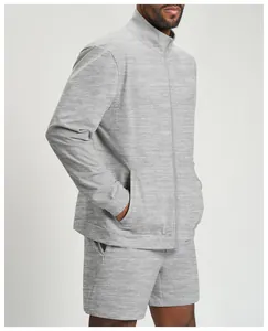 Detailed side view of men's grey heathered athletic zip jacket and matching shorts set