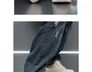 Detailed side view of white men platform sneakers paired with blue distressed denim jeans