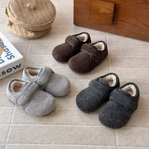 Cozy wool felt children's shoes in brown, grey, and charcoal with faux fur lining