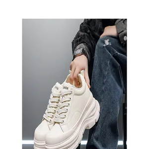 Close-up detail of white chunky platform sneakers for men with 10cm height increase