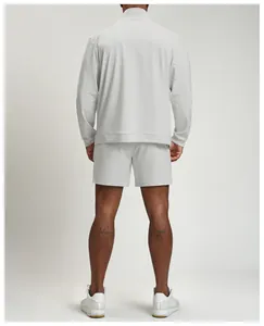 Back view of a men's breathable light grey athletic jacket and matching shorts set.