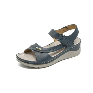 Comfortable navy blue wedge sandals for women featuring adjustable straps and metal trim.