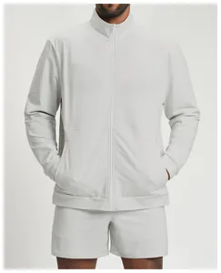 Detail of a men's light gray athletic zip-up jacket and matching shorts