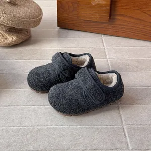 Detailed view of kids' winter wool shoes with warm fuzzy lining and velcro strap.