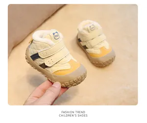 Detail of warm plush-lined toddler shoes featuring non-slip soles and double velcro straps