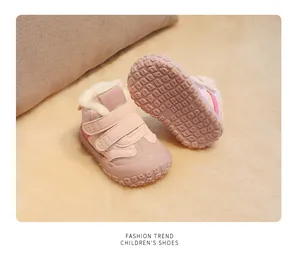 Close-up of pink winter baby boots with non-slip sole and warm fleece lining
