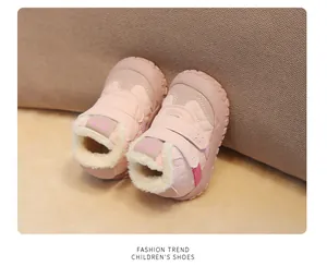 Detail of warm pink toddler winter boots with soft fleece lining and velcro closure.