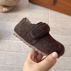 Close-up detail of cozy children's winter wool felt Birkenstock shoes with soft sole