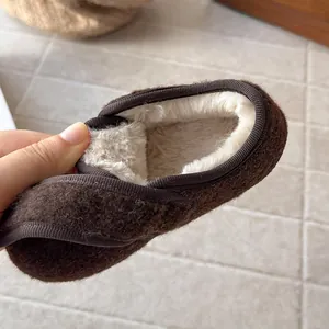 Close-up of warm faux fur lining inside children's brown wool Birkenstock shoes
