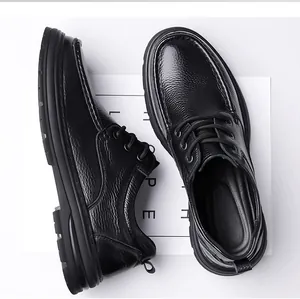 Detailed view of textured black genuine leather men's shoes with anti-slip soles