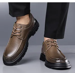 Close-up of brown genuine leather men's dress shoes showing texture and non-slip sole