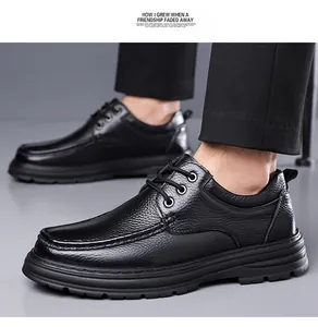 Close-up of black textured top-grain cowhide men's leather shoes with laces