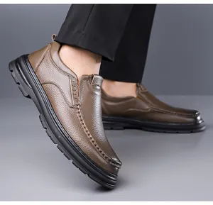 Close-up view of men's brown genuine cowhide leather slip-on loafers with non-slip sole