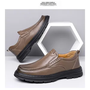 Close-up of men's genuine brown leather loafers with durable non-slip black soles.
