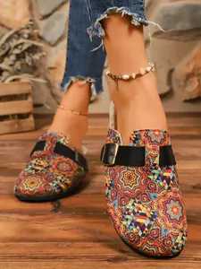 Bohemian style printed closed-toe clogs with adjustable buckle strap and cozy lining