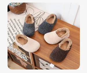 Warm fleece-lined indoor and outdoor slippers with fuzzy interior in neutral tones.