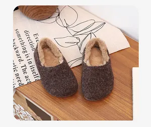 Top view of cozy warm brown fuzzy loafers with thick faux fur lining for winter comfort