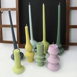 Nordic style colorful ribbed pillar candles with various geometric and pumpkin base shapes