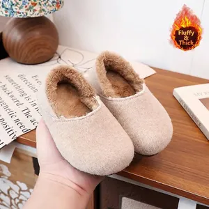 Comfortable warm beige plush-lined loafers with soft soles, presented in a cozy home setting