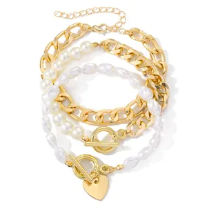 Juego de pulseras de capas con cadenas doradas, perlas de imitación y dije de corazón