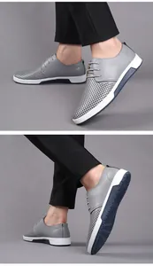 Stylish breathable perforated men's gray leather shoes with casual white sole design