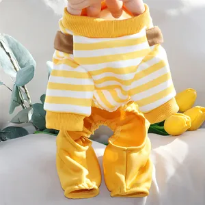 Close-up view of yellow and white striped pet jumpsuit with brown suspender detail