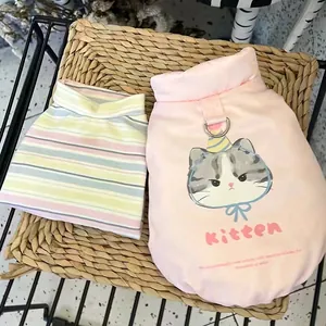 Detailed view of pink kitten-print pet vest with an integrated harness D-ring attachment