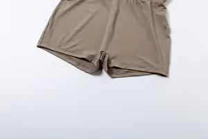 Close-up of khaki solid color bodysuit shorts featuring high-quality hem stitching