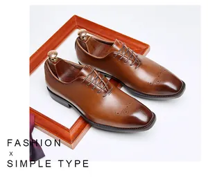 Detailed view of men's brown brogue oxford shoes with elegant wingtip perforations