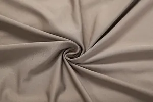 Close-up macro detail of taupe stretch knit fabric showing fine texture and soft drape